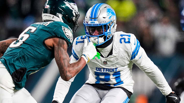Detroit Lions cornerback Amik Robertson (21) defends Philadelphia Eagles wide receiver DeVonta Smith (6) 