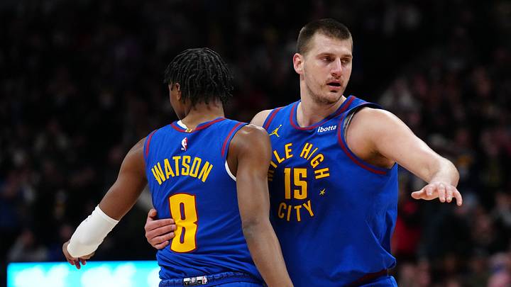 Mar 5, 2024; Denver, Colorado, USA; Denver Nuggets forward Peyton Watson (8) and center Nikola Jokic (15) react in the first half against the Phoenix Suns at Ball Arena. Mar 5, 2024; Denver, Colorado, USA; Denver Nuggets forward Peyton Watson (8) and center Nikola Jokic (15) react in the first half against the Phoenix Suns at Ball Arena.