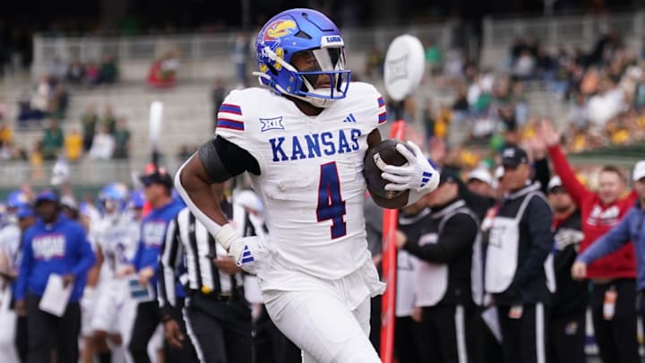 Nov 30, 2024; Waco, Texas, USA;  Kansas Jayhawks running back Devin Neal (4) runs the ball for a touchdown against the Baylor Bears during the first half at McLane Stadium. Mandatory Credit: Chris Jones-Imagn Images