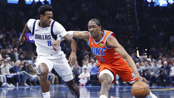 Dec 10, 2024; Oklahoma City, Oklahoma, USA; Oklahoma City Thunder forward Jalen Williams (8) drives to the basket beside Dallas Mavericks forward Olivier-Maxence Prosper (8) during the second quarter at Paycom Center. Mandatory Credit: Alonzo Adams-Imagn Images