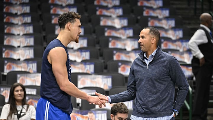 Nov 3, 2024; Dallas, Texas, USA; Dallas Mavericks center Dwight Powell (left) speaks with Mavericks general manager Nico Harrison (right) before the game between the Dallas Mavericks and the Orlando Magic at American Airlines Center. Mandatory Credit: Jerome Miron-Imagn Images
