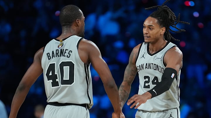 Dec 13, 2025; Las Vegas, Nevada, USA; San Antonio Spurs forward Harrison Barnes (40) and shooting guard Devin Vassell (24) react during the third quarter against the Oklahoma City Thunder at T-Mobile Arena. 