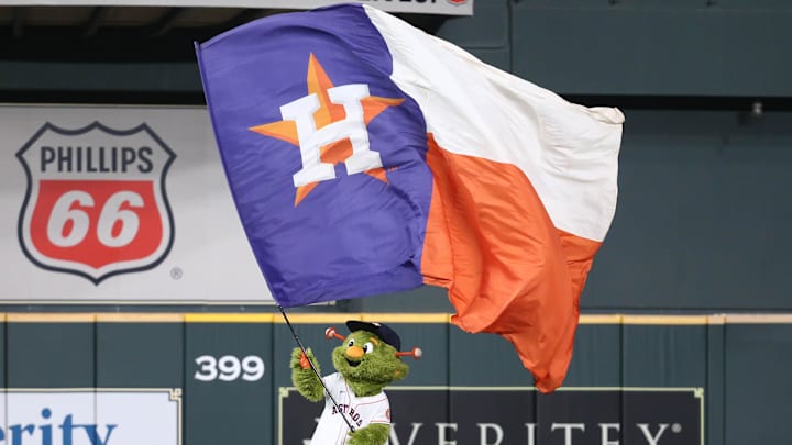 Oct 7, 2021; Houston, Texas, USA; Houston Astros mascot waves a flag after the Astros beat the Chicago White Sox in game one of the 2021 ALDS at Minute Maid Park. Mandatory Credit: Troy Taormina-Imagn Images