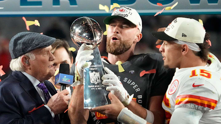 Super Bowl 57: Kansas City Chiefs quarterback Patrick Mahomes passes the Lombardi Trophy to Travis Kelce after winning the Super Bowl against the Philadelphia Eagles at State Farm Stadium on Feb 12, 2023.