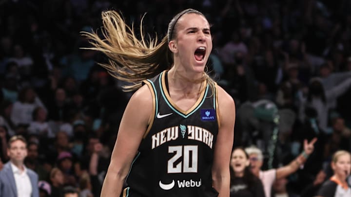 New York Liberty guard Sabrina Ionescu celebrates scoring a basket. New York Liberty guard Sabrina Ionescu celebrates scoring a basket.