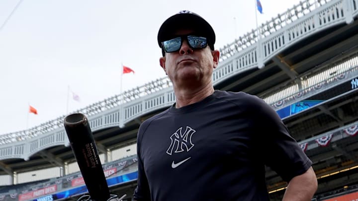 Sep 30, 2025; Bronx, New York, USA; New York Yankees manager Aaron Boone (17) watches batting practice before game one of the Wildcard round of the 2025 MLB playoffs against the Boston Red Sox at Yankee Stadium. Mandatory Credit: Brad Penner-Imagn Images