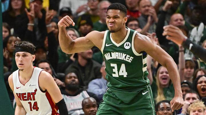 Oct 30, 2023; Milwaukee, Wisconsin, USA;  Milwaukee Bucks forward Giannis Antetokounmpo (34) reacts after scoring a basket as Miami Heat guard Tyler Herro (14) looks on in the fourth quarter at Fiserv Forum. Mandatory Credit: Benny Sieu-Imagn Images