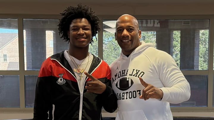 Oklahoma wide receiver commit Tra'Von Hall, wide receivers coach Emmett Jones.