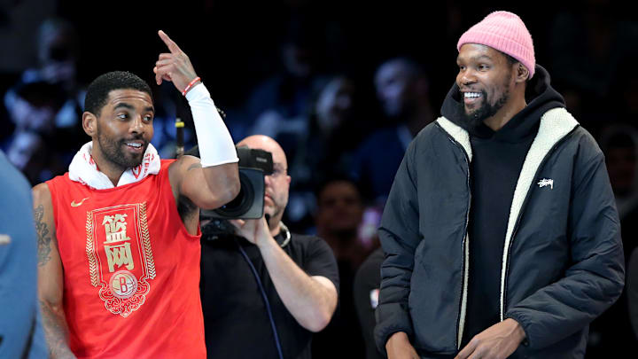 Jan 26, 2023; Brooklyn, New York, USA; Brooklyn Nets guard Kyrie Irving (11) and forward Kevin Durant (7) react after being announced as 2013 all stars during the second quarter against the Detroit Pistons at Barclays Center. Mandatory Credit: Brad Penner-Imagn Images Jan 26, 2023; Brooklyn, New York, USA; Brooklyn Nets guard Kyrie Irving (11) and forward Kevin Durant (7) react after being announced as 2013 all stars during the second quarter against the Detroit Pistons at Barclays Center. Mandatory Credit: Brad Penner-Imagn Images
