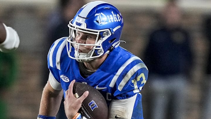 Duke Blue Devils quarterback Riley Leonard (13) runs the ball
