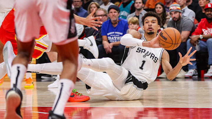 Feb 5, 2025; Atlanta, Georgia, USA; San Antonio Spurs center Victor Wembanyama (1) passes after controlling a loose ball against the Atlanta Hawks in the first quarter at State Farm Arena. Feb 5, 2025; Atlanta, Georgia, USA; San Antonio Spurs center Victor Wembanyama (1) passes after controlling a loose ball against the Atlanta Hawks in the first quarter at State Farm Arena.