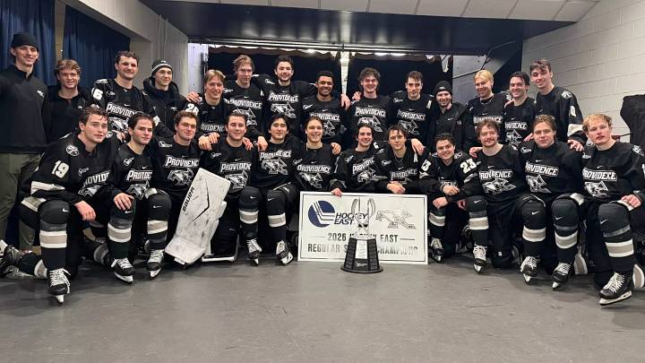 Providence players pose after winning the 2025-26 Hockey East regular season championship. 