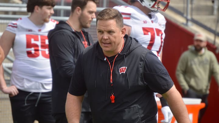 Wisconsin assistant AJ Blazek worked with his offensive line during the Badgers' spring showcase April 19.