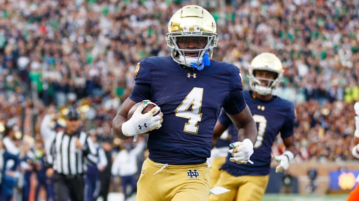 Notre Dame running back Jeremiyah Love (4) runs the ball into the end zone for a touchdown in the first half of a NCAA football game against Syracuse at Notre Dame Stadium on Saturday, Nov. 22, 2025, in South Bend.