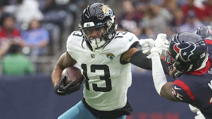 Jan 1, 2023; Houston, Texas, USA; Jacksonville Jaguars wide receiver Christian Kirk (13) runs with the ball as Houston Texans cornerback Desmond King II (25) attempts to make a tackle during the first quarter at NRG Stadium. Mandatory Credit: Troy Taormina-Imagn Images Jan 1, 2023; Houston, Texas, USA; Jacksonville Jaguars wide receiver Christian Kirk (13) runs with the ball as Houston Texans cornerback Desmond King II (25) attempts to make a tackle during the first quarter at NRG Stadium. Mandatory Credit: Troy Taormina-Imagn Images