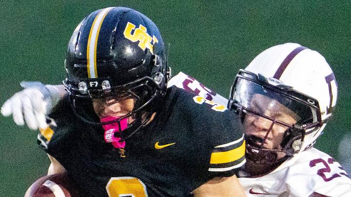 Dowling Catholic's Grayson Pennington (23) makes a tackle on Southeast Polk's Brennan Swanson (3) on Sept. 18, 2026, at Southeast Polk High School. Dowling Catholic's Grayson Pennington (23) makes a tackle on Southeast Polk's Brennan Swanson (3) on Sept. 18, 2026, at Southeast Polk High School.