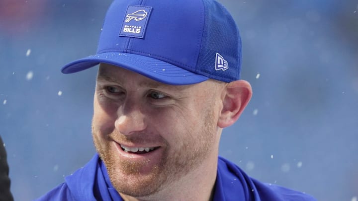 Buffalo Bills offensive coordinator Joe Brady greets players as they take the field before their game against the Bengals