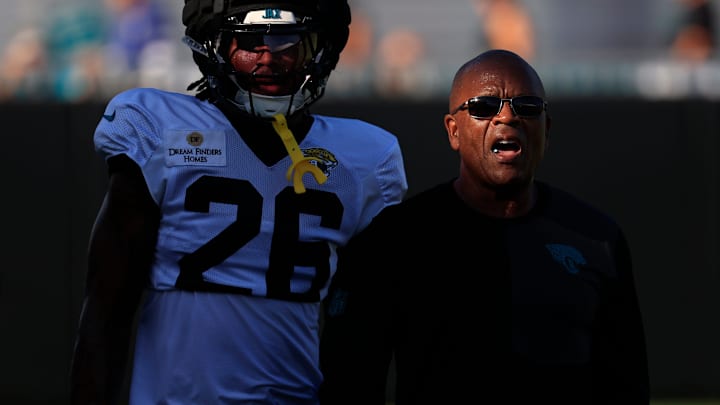 Jacksonville Jaguars safety Antonio Johnson (26) walks next to secondary coach Ron Milus during an NFL training camp session at the Miller Electric Center, Tuesday, July 29, 2025, in Jacksonville, Fla. [Corey Perrine/Florida Times-Union]