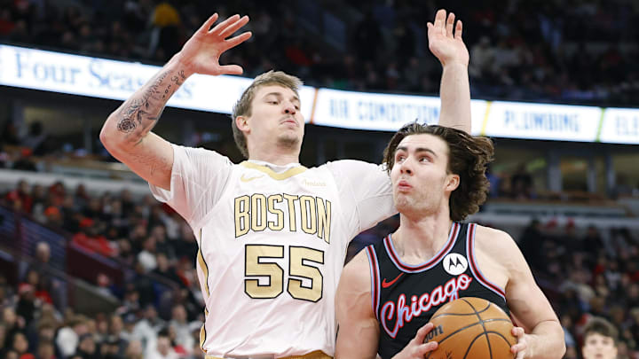 Jan 24, 2026; Chicago, Illinois, USA; Chicago Bulls guard Josh Giddey (3)drives to the basket against Boston Celtics guard Baylor Scheierman (55)during the first half at United Center. Mandatory Credit: Kamil Krzaczynski-Imagn Images
