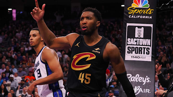 Mar 19, 2025; Sacramento, California, USA; Cleveland Cavaliers guard Donovan Mitchell (45) looks for a goaltending call against Sacramento Kings forward Keegan Murray (13) during the fourth quarter at Golden 1 Center. Mandatory Credit: Kelley L Cox-Imagn Images