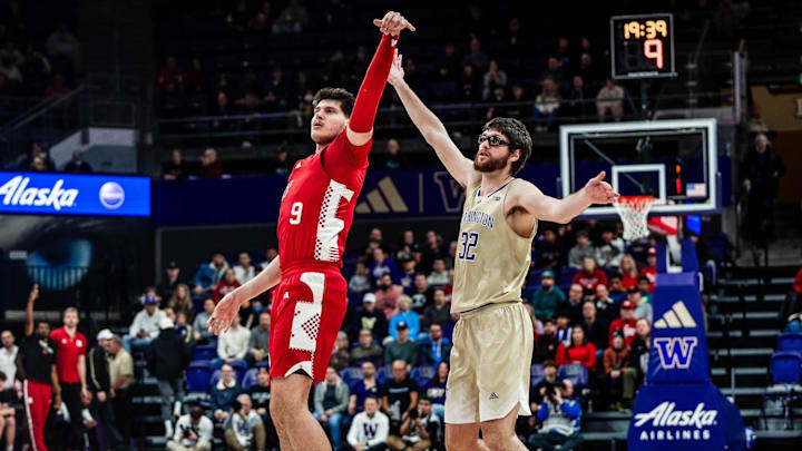 Nebraska forward Berke Büyüktuncel shoots a 3 against the Huskies.