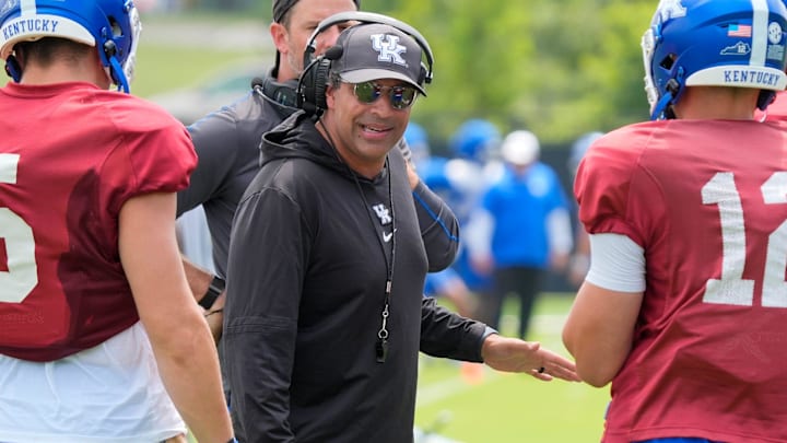 Kentucky Wildcats offensive coordinator and quarterback coach Bush Hamdan coaches the quarterbacks during practice on Friday, August 1, 2025