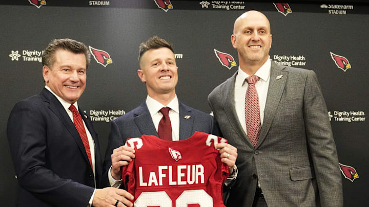 Arizona Cardinals president Michael Bidwill, new head coach Mike LaFleur, and general manager Monti Ossenfort pose for a photograph on Feb. 3, 2026, at Arizona Cardinals training center in Tempe.