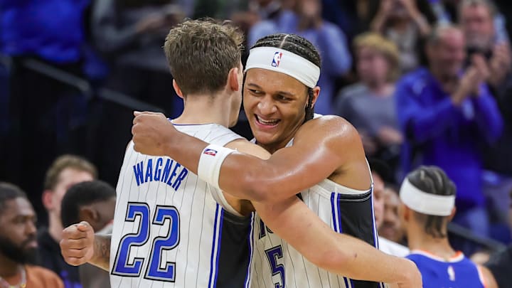 Dec 29, 2023; Orlando, Florida, USA; Orlando Magic forward Franz Wagner (22) and forward Paolo Banchero (5) celebrate their 117-108 win against the New York Knicks at KIA Center. Mandatory Credit: Mike Watters-Imagn Images