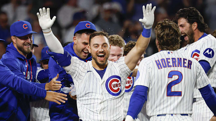 May 4, 2026; Chicago, Illinois, USA; Chicago Cubs right fielder Michael Conforto (20) celebrates with teammates after hitting a game winning solo home run against the Cincinnati Reds during the ninth inning at Wrigley Field. Mandatory Credit: Kamil Krzaczynski-Imagn Images