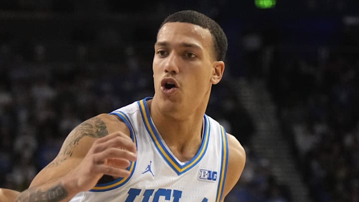 Jan 7, 2025; Los Angeles, California, USA; UCLA Bruins guard Kobe Johnson (0) dribbles the ball against Michigan Wolverines guard Nimari Burnett (4) in the second half at Pauley Pavilion presented by Wescom. Mandatory Credit: Kirby Lee-Imagn Images Jan 7, 2025; Los Angeles, California, USA; UCLA Bruins guard Kobe Johnson (0) dribbles the ball against Michigan Wolverines guard Nimari Burnett (4) in the second half at Pauley Pavilion presented by Wescom. Mandatory Credit: Kirby Lee-Imagn Images