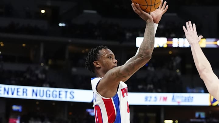 Dec 28, 2024; Denver, Colorado, USA; Detroit Pistons forward Ronald Holland II (00) shoots the ball over Denver Nuggets guard Christian Braun (0) in the second half at Ball Arena. Mandatory Credit: Ron Chenoy-Imagn Images