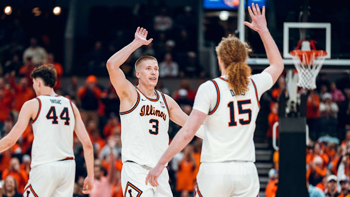 Illinois forward Ben Humrichous (3) celebrates with teammate and forward Jake Davis (15) in the Illini's 91-48 runaway win over Missouri on Monday in St. Louis.
