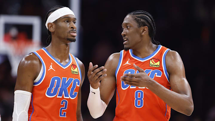Nov 10, 2024; Oklahoma City, Oklahoma, USA; Oklahoma City Thunder guard Shai Gilgeous-Alexander (2) and forward Jalen Williams (8) talk during a time out against the Golden State Warriors during the second half at Paycom Center. Mandatory Credit: Alonzo Adams-Imagn Images