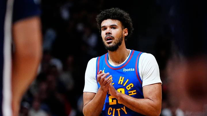 Mar 11, 2026; Denver, Colorado, USA; Denver Nuggets forward Cameron Johnson (23) reacts in the third quarter against the Houston Rockets at Ball Arena. Mandatory Credit: Ron Chenoy-Imagn Images