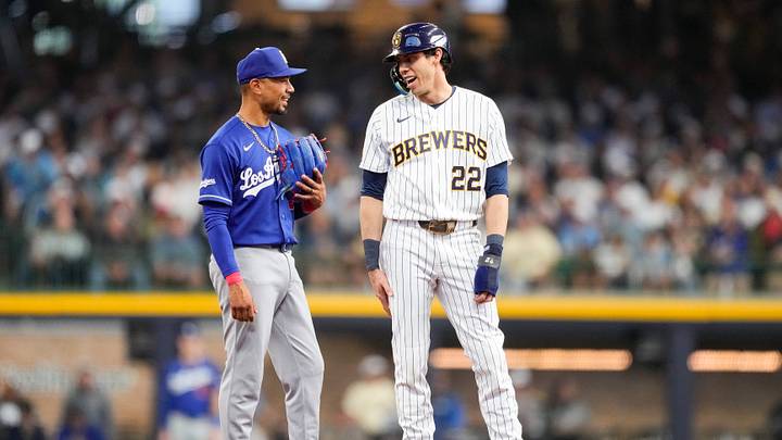May 23, 2026; Milwaukee, Wisconsin, USA; Los Angeles Dodgers shortstop Mookie Betts (50) talks with Milwaukee Brewers designated hitter Christian Yelich (22) during the first inning at American Family Field. Mandatory Credit: Jeff Hanisch-Imagn Images May 23, 2026; Milwaukee, Wisconsin, USA; Los Angeles Dodgers shortstop Mookie Betts (50) talks with Milwaukee Brewers designated hitter Christian Yelich (22) during the first inning at American Family Field. Mandatory Credit: Jeff Hanisch-Imagn Images