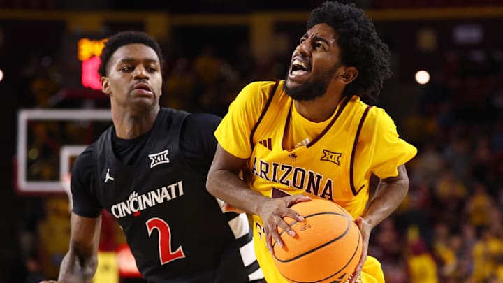 Jan 24, 2026; Tempe, Arizona, USA; Cincinnati Bearcats guard Jizzle James (2) defends against Arizona State Sun Devils guard Maurice Odum (5) at Desert Financial Arena. Mandatory Credit: Mark J. Rebilas-Imagn Images