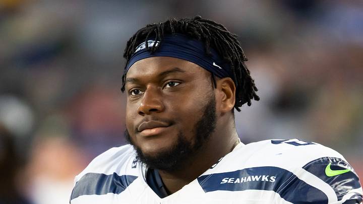 Seattle Seahawks guard Christian Haynes stands on the sidelines