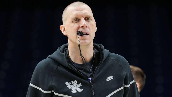 Kentucky Wildcats head coach Mark Pope walks onto the court Thursday, March 27, 2025, during practice ahead of the Sweet 16 March Madness tournament game against the Tennessee Volunteers at Lucas Oil Stadium in Indianapolis.