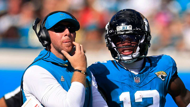 Jacksonville Jaguars head coach Liam Coen looks to the video scoreboard with wide receiver Travis Hunter (12) during the fourth quarter of an NFL football matchup, Sunday, Oct. 12, 2025, at EverBank Stadium in Jacksonville, Fla. 