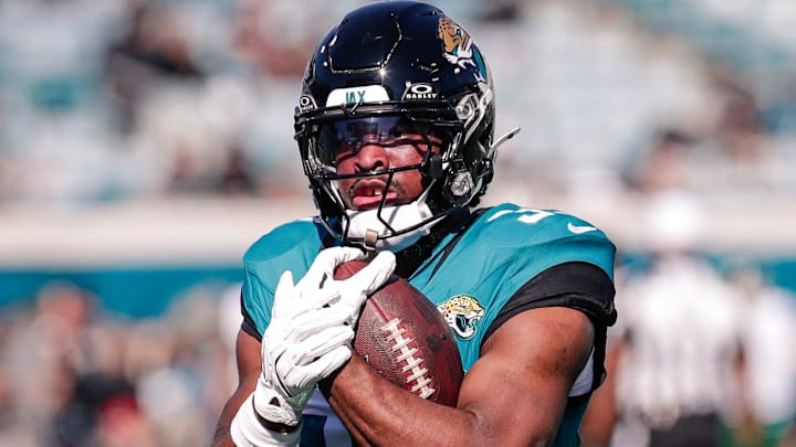 Dec 14, 2025; Jacksonville, Florida, USA;Jacksonville Jaguars running back Bhayshul Tuten (33) warms up during pregame warmups against the New York Jets at EverBank Stadium.