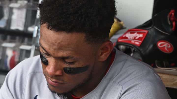 Boston Red Sox center fielder Ceddanne Rafaela (3) cleans his cleats in the dugout against the Washington Nationals during the eighth inning at Nationals Park on July 6. 