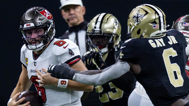 Tampa Bay Buccaneers quarterback Baker Mayfield (6) is sacked by New Orleans Saints linebacker Willie Gay (6) during the second half at Caesars Superdome.