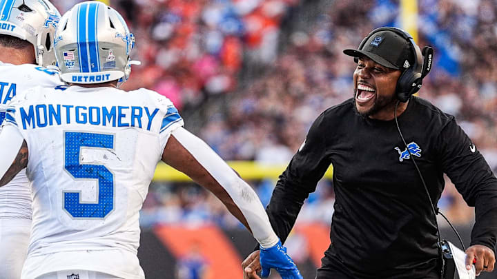 Detroit Lions running backs coach Tashard Rice, right, celebrates with running back David Montgomery (5) Detroit Lions running backs coach Tashard Rice, right, celebrates with running back David Montgomery (5)