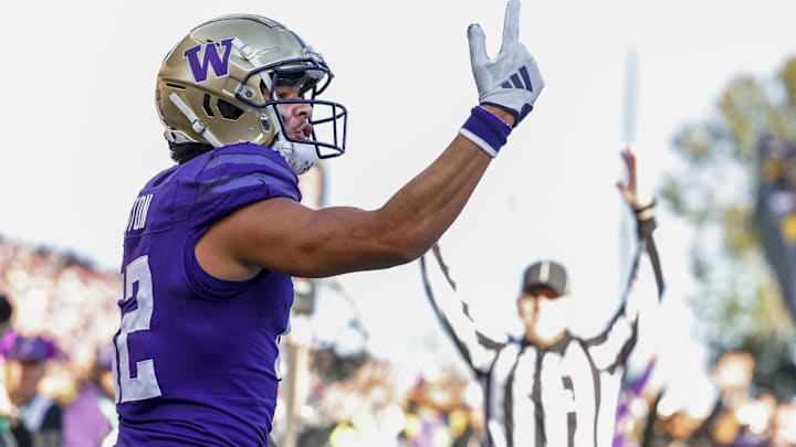 Washington Huskies wide receiver Denzel Boston celebrates after catching a touchdown against Michigan.