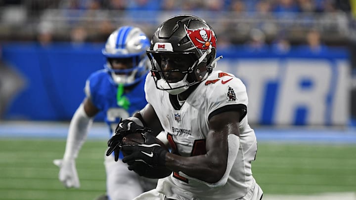 Sep 15, 2024; Detroit, Michigan, USA; Tampa Bay Buccaneers wide receiver Chris Godwin (14) scores a touchdown against the Detroit Lions in the second quarter at Ford Field. Mandatory Credit: Eamon Horwedel-Imagn Images