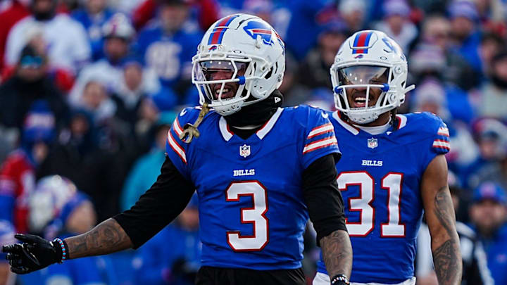Buffalo Bills safety Damar Hamlin smiles after almost intercepting a. Pass during the second half of the Buffalo Bills wild card game against the Denver Broncos at Highmark Stadium in Orchard Park on Jan. 12, 2025. Behind him are teammates Buffalo Bills cornerback Rasul Douglas and Buffalo Bills cornerback Cam Lewis.