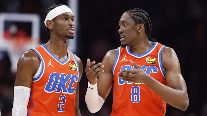Nov 10, 2024; Oklahoma City, Oklahoma, USA; Oklahoma City Thunder guard Shai Gilgeous-Alexander (2) and forward Jalen Williams (8) talk during a time out against the Golden State Warriors during the second half at Paycom Center. Mandatory Credit: Alonzo Adams-Imagn Images