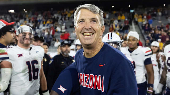 Nov 28, 2025; Tempe, Arizona, USA; Arizona Wildcats head coach Brent Brennan celebrates against the Arizona State Sun Devils during the 99th Territorial Cup at Mountain America Stadium. Mandatory Credit: Mark J. Rebilas-Imagn Images Nov 28, 2025; Tempe, Arizona, USA; Arizona Wildcats head coach Brent Brennan celebrates against the Arizona State Sun Devils during the 99th Territorial Cup at Mountain America Stadium. Mandatory Credit: Mark J. Rebilas-Imagn Images