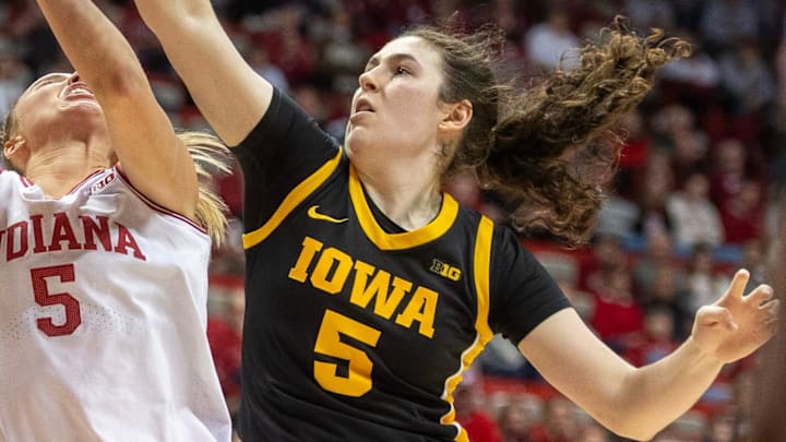 Indiana's Lenée Beaumont (5) is blocked by Iowa's Ava Heiden (5) during the Indiana versus Iowa womens basketball game at Simon Skjodt Assembly Hall on Sunday, Jan. 11, 2026.