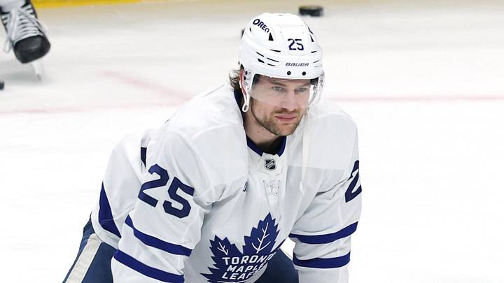 Jan 17, 2026; Winnipeg, Manitoba, CAN; Toronto Maple Leafs defenseman Brandon Carlo (25) and Toronto Maple Leafs defenseman Troy Stecher (28) warm up before a game against the Winnipeg Jets at Canada Life Centre. Mandatory Credit: James Carey Lauder-Imagn Images